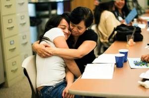 A parent hugs her teenage daughter while participating in Planned Parenthoods LiFT program. Photo courtesy Planned Parenthood of the Great Northwest and the Hawaiian Islands