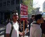 Christian Jimenez, 19, marched on behalf of his parents, who are immigrants from Mexico. Photo by Melissa Hellmann
