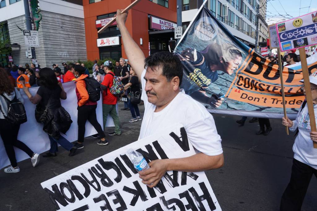 Carlos Lopez, 48, said he joined the march to fight against racism towards immigrants. Photo by Melissa Hellmann