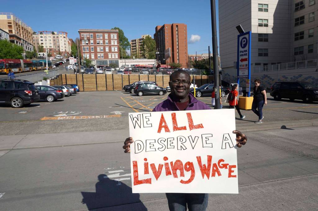Baboucarr Njai marched for workers rights and to express his concern about President Donald Trumps immigration policies. Photo by Melissa Hellmann