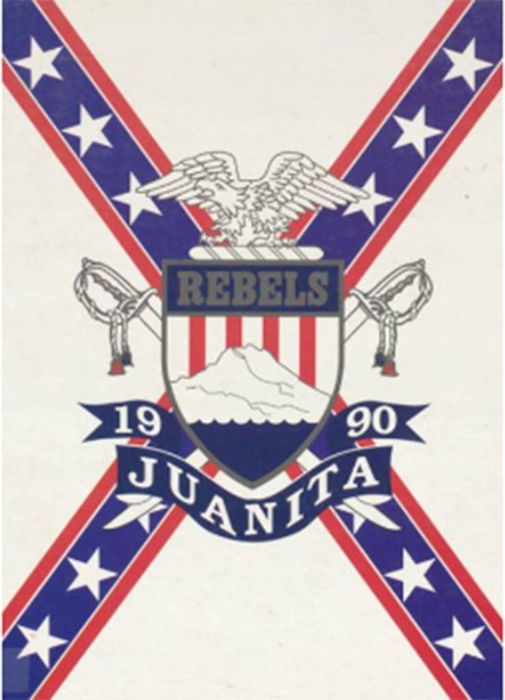 The 1990 Juanita High School logo featuring the stars and bars design in the background. The design is associated with the Confederate flag and was changed in the early 1990s after JHS staff voiced objections to it. Courtesy of Lake Washington School District