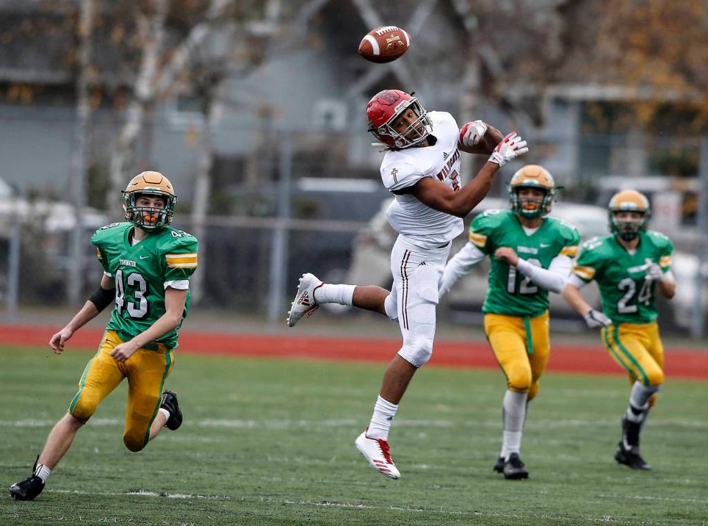 A pass sails out of reach of Archbishop Murphys Kyler Gordon (center) in the fourth quarter of a Class 2A semifinal state football game. The Washington Interscholastic Athletic Association is changing how football playoffs will be seeded. Photo by Ian Terry/The Herald