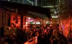 Patrons grab a drink at the outdoor space of Kremwerk Complex. Photo via Kremwerk