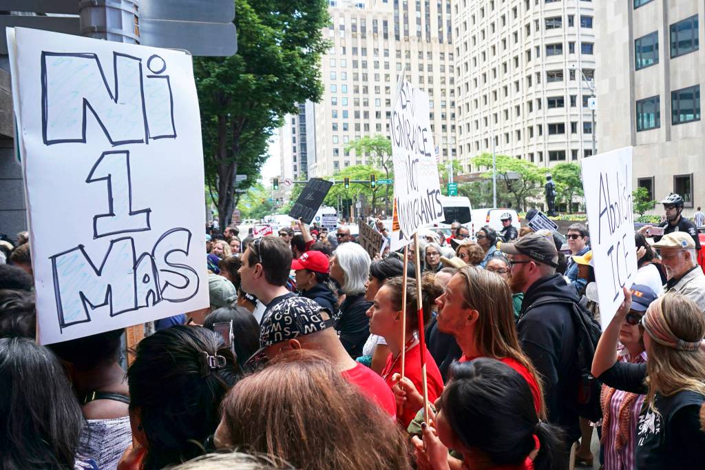 A crowd forms outside of the Seattle Immigration Court for Maru Mora Villalpandos second deportation hearing. Photo by Melissa Hellmann