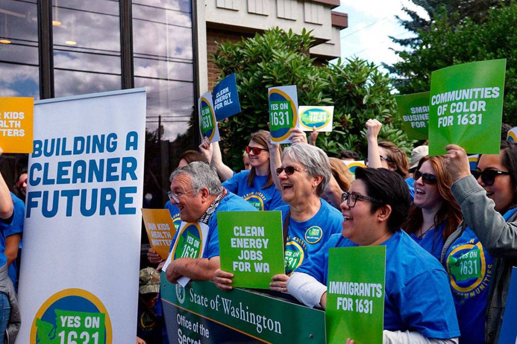 Activists rallied in support of I-1631 in Olympia on July 2. The Yes on I-1631 campaign collected roughly 100,000 more signatures than needed to place the initiative on the November ballot. 
Photo contributed by Yes on I-1631