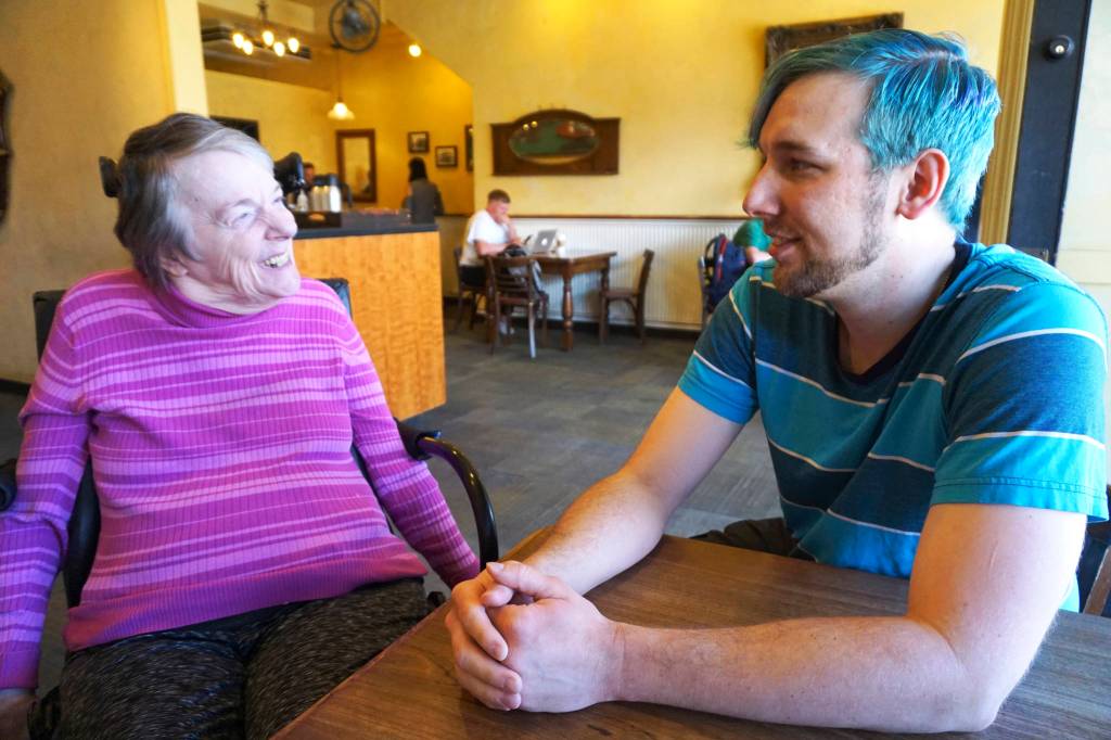 Dianne Laurine (left) and Shaun Bickley (right), Commissioners for the Seattle Commission for People with Disabilities, say that the city didnt consult with the disabled community prior to passing the straw ban. [Image description: Laurine is wearing a purple turtleneck and facing Bickley, who has blue hair and is wearing a striped blue shirt. They are sitting at a table at Queen Annes Uptown Espresso.] Photo by Melissa Hellmann