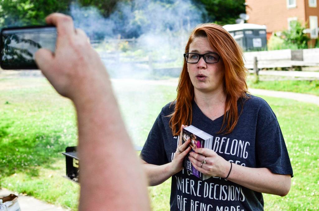 Sarah Smith addresses her supporters through a Facebook Live video stream before canvassing at a July 7 campaign volunteer barbecue in Southeast Seattle. Photo by Josh Kelety