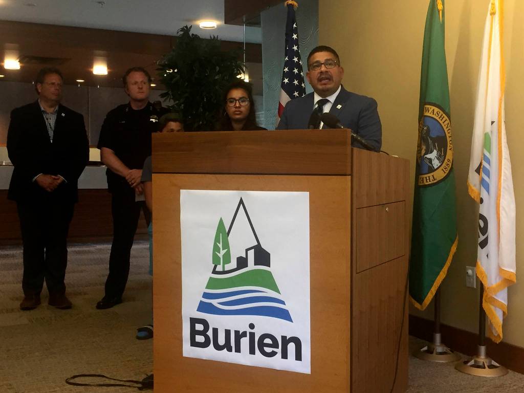 Burien Mayor Jimmy Matta stands alongside family members, Burien Police Chief Ted Boe, and Burien City Manager Brian Wilson at a July 23 press conference. Photo by Josh Kelety