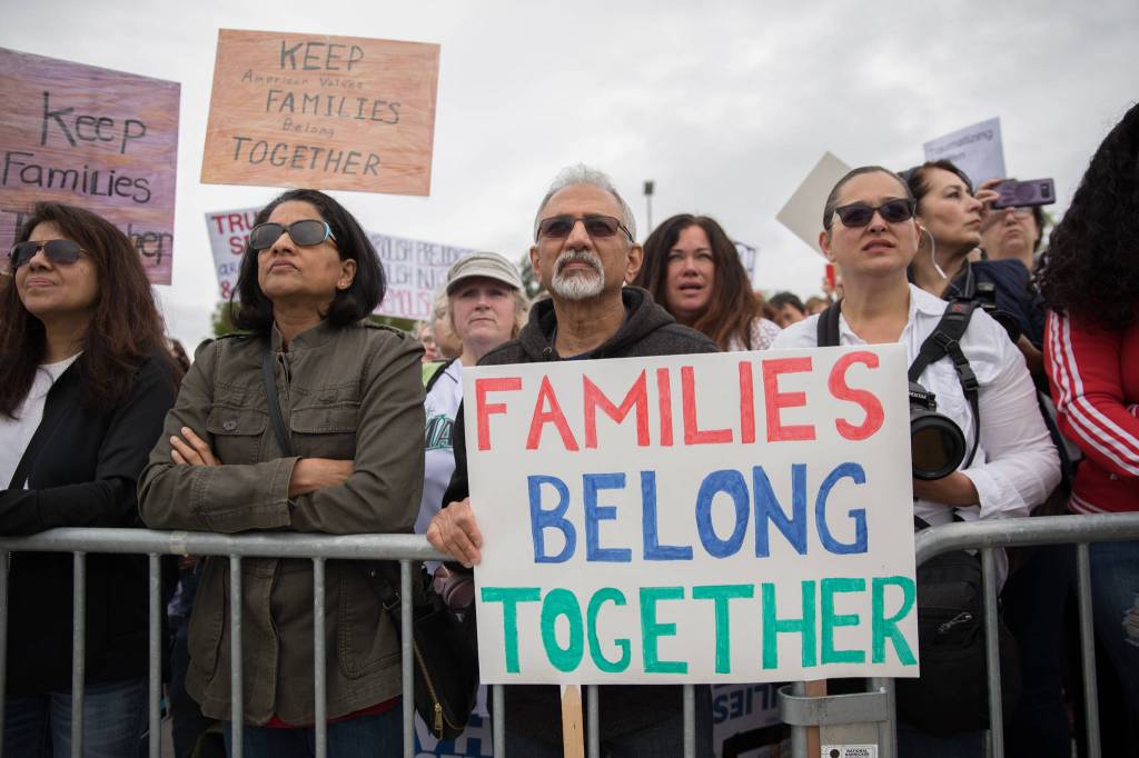 Protestors gather at SeaTacs Families Belong Together rally. Photo by Alex Garland