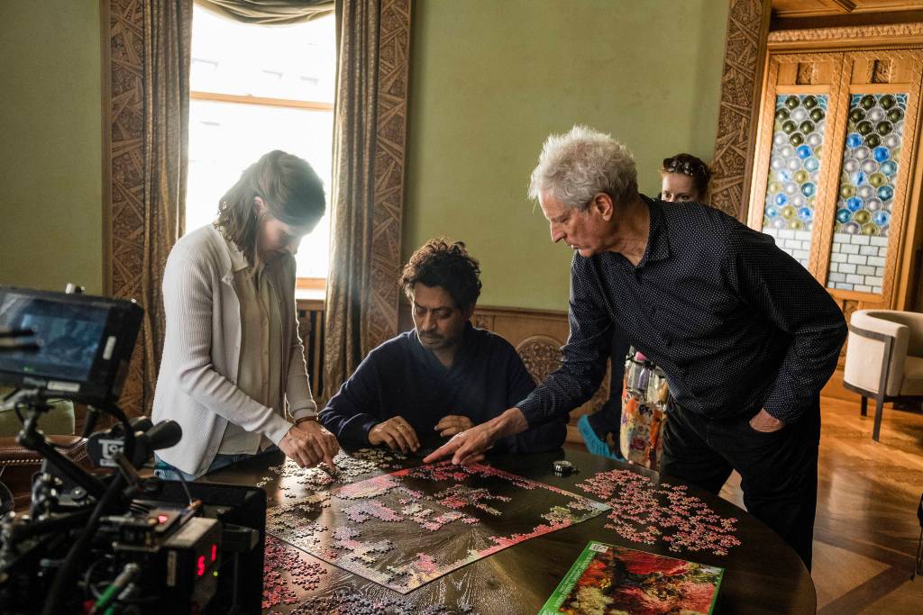 Kelly Macdonald, Irrfan Khan, and director Marc Turtletaub put together the pieces on the set of Puzzle. 
Photo by Linda Kallerus/Sony Pictures Classics