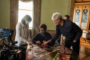 Kelly Macdonald, Irrfan Khan, and director Marc Turtletaub put together the pieces on the set of Puzzle. 
Photo by Linda Kallerus/Sony Pictures Classics