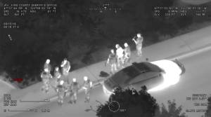 Bellevue police arrest the suspect as seen from as seen from King County Sheriffs Guardian One helicopter. Screenshot from the King County Sheriff Air Support YouTube page