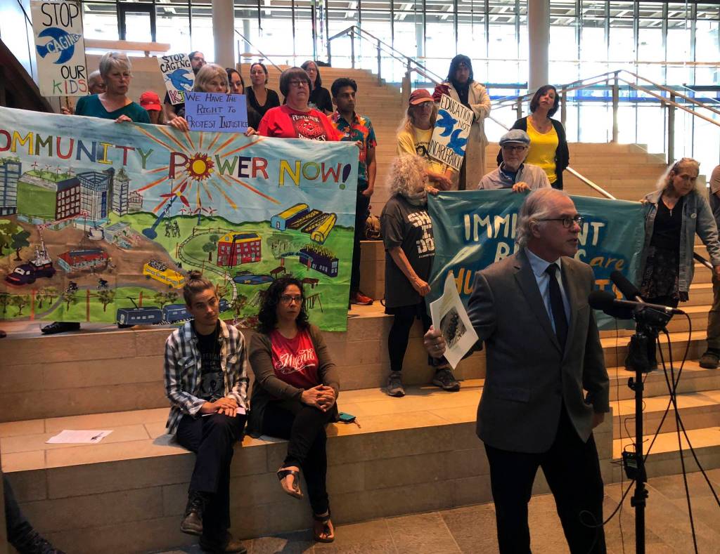 At a Sept. 4 press conference, Neil Fox, secretary of the National Lawyers Guilds Seattle chapter, opposes City Attorney Pete Holmes tough stance on demonstrators who block traffic. Photo by Melissa Hellmann