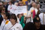 Protesters gather at SeaTacs Families Belong Together rally. Photo by Alex Garland
