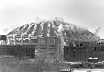 The Kingdome come-down: A city landmark turns to dust and is washed from city streets, if not memory.
