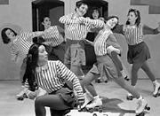 Girls on skates! Rounding the track in Rain City Rollers.