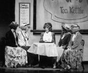 Kim Douglass, center, plays Maggie Jones in 42nd Street.