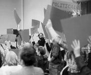 Out of the library: Grad students at an October 24 rally sing a chorus of "Power to the Workers!"