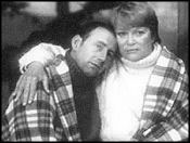 Partners in plaid: Fletcher consoles Gross.