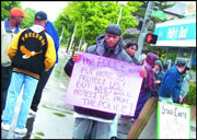 Words on the street: Protesters spontaneously gathered after Aaron Roberts was shot.