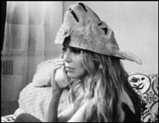 Zany! Anna Thomson wears sheep mask on head!