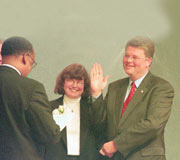 Mayor Greg Nickels and wife Sharon are all smiles as former Mayor Norm Rice delivers the oath of office.