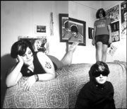 The Gossip: Beth Ditto, Nathan Howdeschell, and Kathy Mendonca (standing).