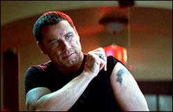 Gym-fresh Travolta in Basic.