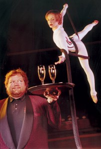 ZinZanni headliner Crystalle reaches for Tom Douglas' bubbly.