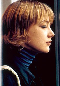 Akinshina, the child, sees her dark reflection as a woman.