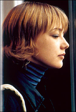 Akinshina, the child, sees her dark reflection as a woman.