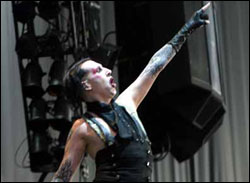 Marilyn Manson shows us his tits.