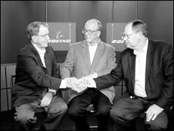 From left, on Monday: new Boeing Chief Executive Officer Harry Stonecipher, new Chairman of the Board Lew Platt, and outgoing CEO and Chairman Phil Condit.