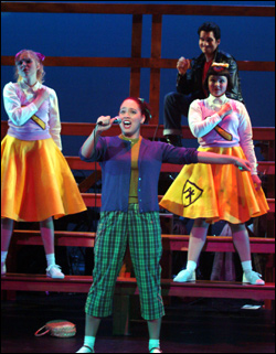 Harris (center) croons her devotion.