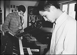 M83 take a break from cloudgazing to stare at their shoes.