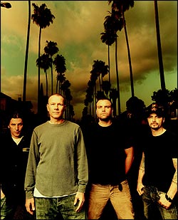 The revamped Helmet pose in front of some very conceptually appropriate palm trees.