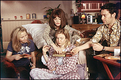 Zellweger (center) is plied with temptation.