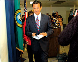 In Bellevue Monday, June 6, Dino Rossi exits the campaign for governor after zinging the state Supreme Court.