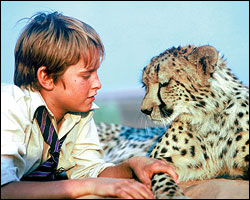 Alexander Michaletos and one of the four tame cats used in Duma.