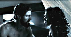 Spartan leader Gerard Butler shows queen Lena Headey his softer side.