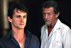 Hurt (right) wises up Hugh Dancy.