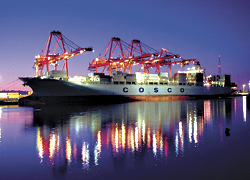A container ship being worked at the Ports Harbor Island terminal.