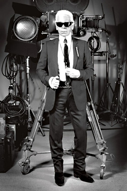 Dont touch his rings! Dont touch his majestic white ponytail! Karl Lagerfeld hates you, because you are ugly and fat.