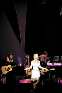 Parton: part country royalty, part hayseed comedienne.