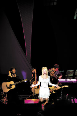 Parton: part country royalty, part hayseed comedienne.