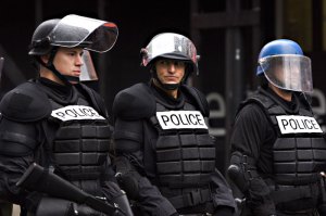 Harrelson (center) shows the good beneath the badge.