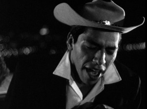 Eddie Sunshine (left) singing on Hill X in Kent Mackenzie's THE EXILES (1961). Charles Burnett and Sherman Alexie present a Milestone Films release. The film was restored from the original 35mm materials by Ross Lipman and the UCLA Film & Television Archive.