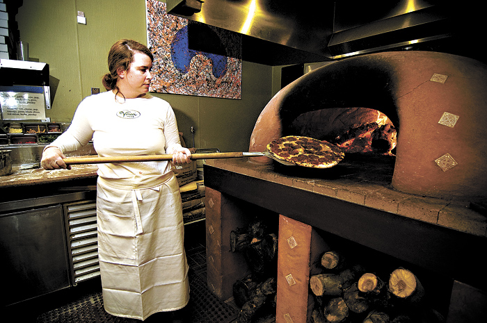 Snatching an innocent pizza from the (wood-)fiery inferno.