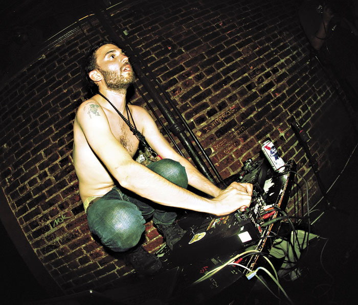 DJ Darwin surfs and mixes at the same time.