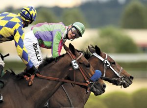 Hoonan-Trujillo (aboard horse #3) is the second-winningest female jockey in Emerald Downs History.